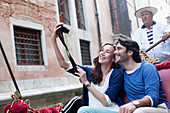 Smiling couple taking self-portrait