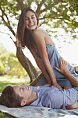 Portrait of smiling couple on blanket