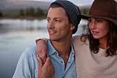 Close up of hugging couple at lake