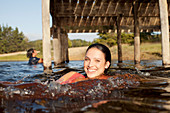 Portrait of smiling woman swimming