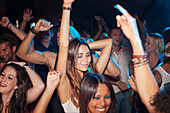 Crowd dancing on dance floor