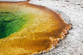 Rock formations and colorful pool