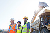 Workers standing on site