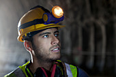 Worker standing in tunnel