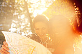 Women looking at roadmap outdoors