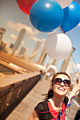 Woman with bunch of balloons