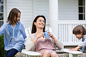 Mother and children relaxing outdoors