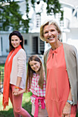 Three generations of women walking