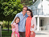 Family smiling together outdoors