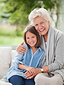 Woman and granddaughter smiling