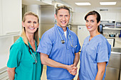 Smiling veterinarians standing together