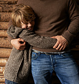 Smiling son hugging father