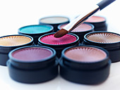 Close up of makeup brush and eyeshadows