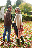 Couple holding hands outdoors