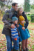 Family smiling together outdoors