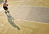 Man playing basketball on court