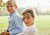 Mother and son relaxing in urban park