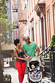 Family walking together on city street