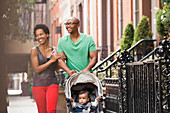 Family walking together on city street