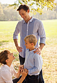 Family relaxing together in park