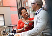 Couple talking on city street