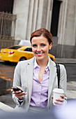 Businesswoman using cell phone