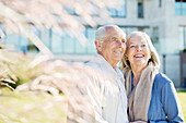 Older couple smiling outdoors