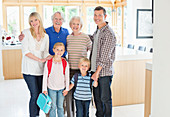 Family smiling together in kitchen