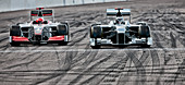 Race cars driving on track