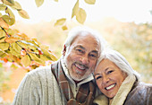 Older couple smiling in park