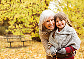 Grandmother and granddaughter in park