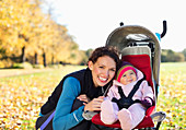 Woman smiling with baby in stroller