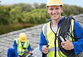 Worker smiling on rooftop