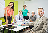Business people smiling in meeting