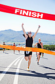 Runner crossing race finish line