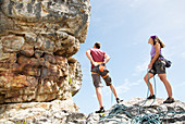 Climbers examining rock formation