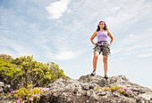 Climber standing on rocky hilltop
