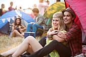 Couple hugging outside tent