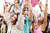 Fans cheering at music festival