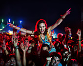Cheering woman at music festival