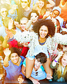 Cheering woman on man's shoulders