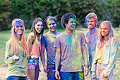 Portrait of friends covered in chalk dye