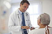 Doctor talking to older patient