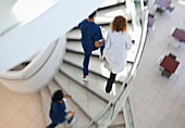 Hospital staff climbing spiral steps