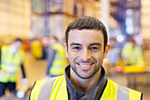 Worker smiling in warehouse