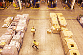 Blurred view of workers carrying boxes