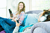 Couple relaxing together on sofa