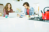 Couple relaxing together in kitchen