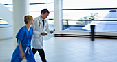 Doctor and nurse talking hallway