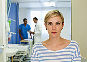 Patient standing in hospital room